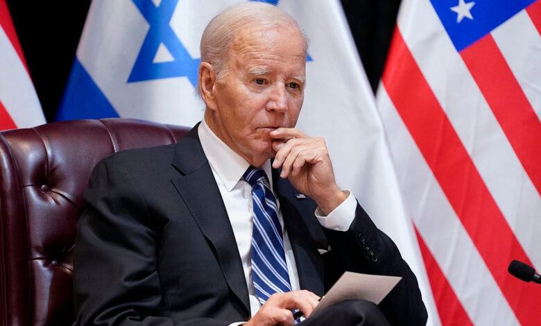 Biden listens during meeting in Israel